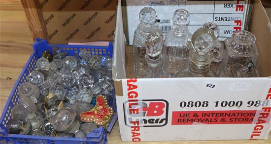 A collection of cut glass decanters and stoppers